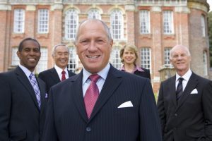 executive stakeholders in front of a building